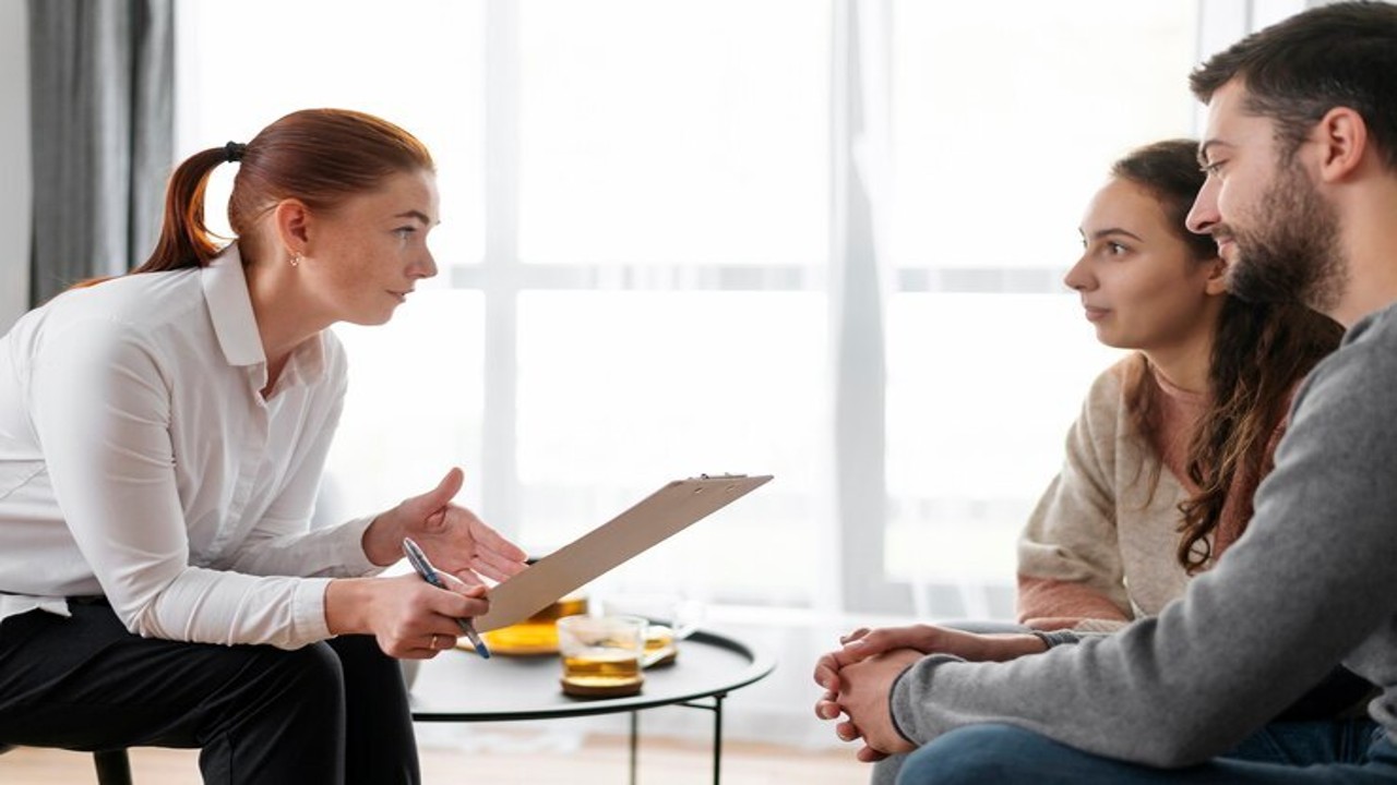 A couple consulting with an IVF specialist in a modern clinic in Thane